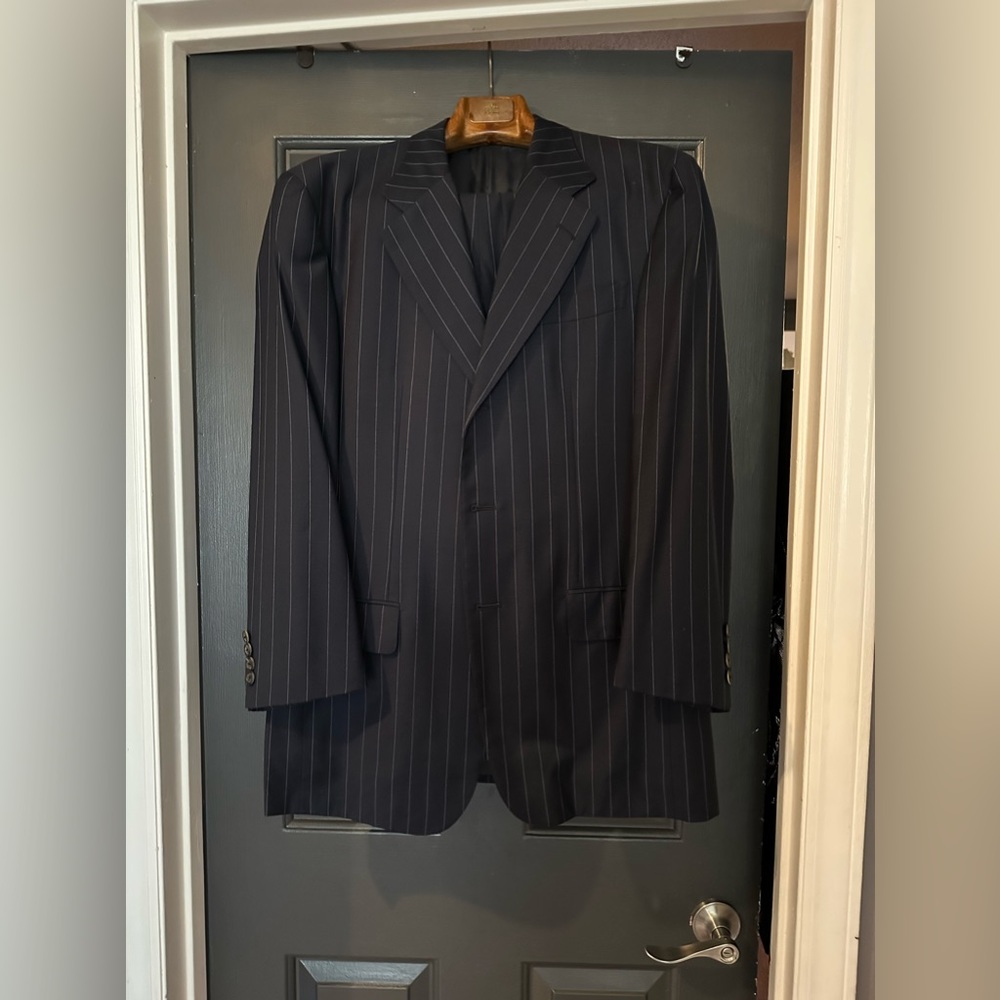 Men’s navy blue pin striped suit